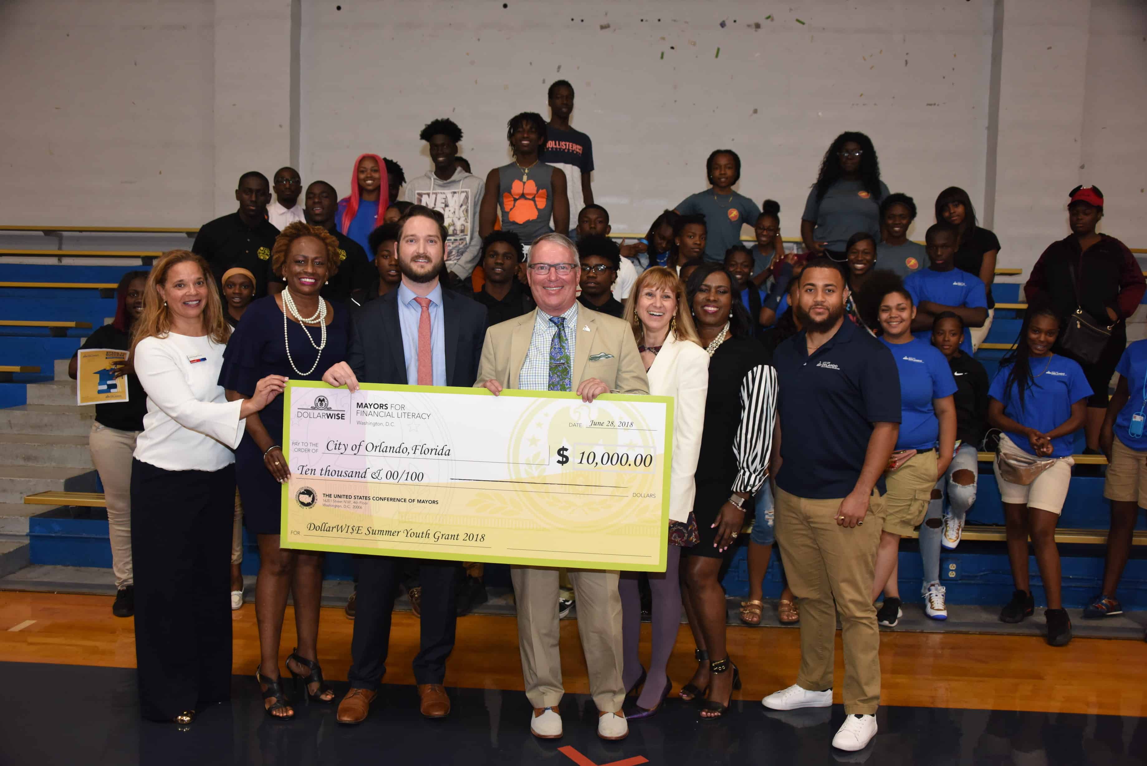 Orlando DollarWise Award Event 2018 Orlando Mayor Buddy Dyer is awarded a 2018 DollarWise Grant to support his City's Parramore Kidz Zone Summer Youth Employment Program